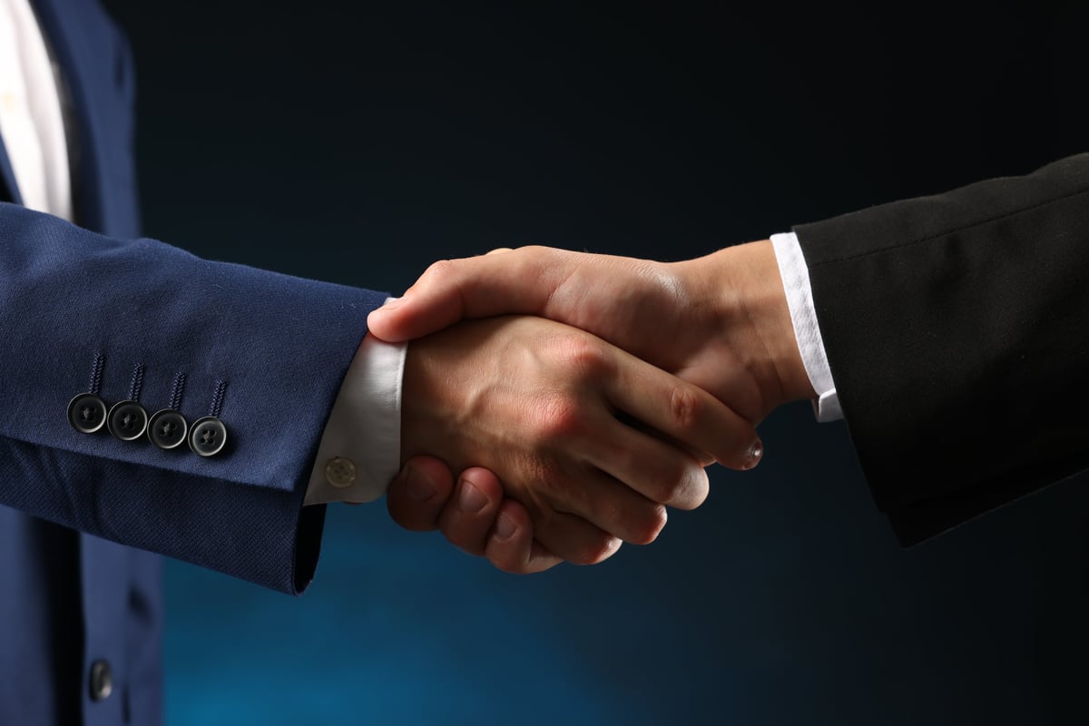 Business partners shaking hands